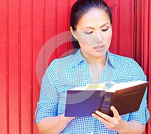 Pretty Mixed Race Woman Reading Holy Bible