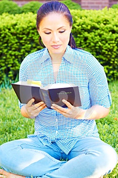 Pretty Mixed Race Woman Reading The Holy Bible