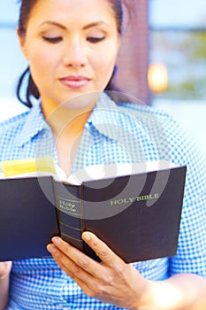 Pretty Mixed Race Woman Reading Holy Bible