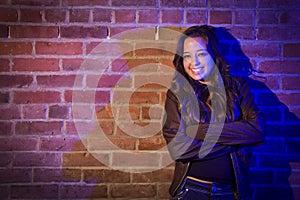 Pretty Mixed Race Young Adult Woman Against a Brick Wall