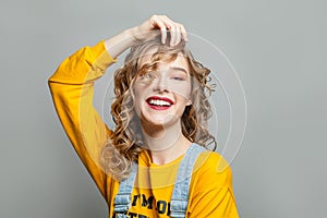 Pretty model girl smiling on gray background