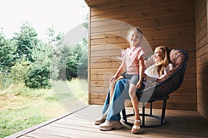 Pretty mother and her cute daughter having fun and resting