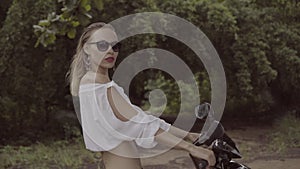 Pretty naturally looking woman on summer day with straw hat