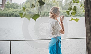 Pretty nice blonde woman in rainy day