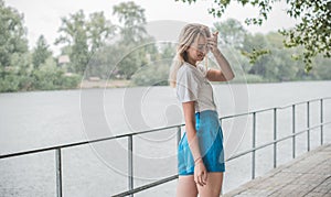 Pretty nice blonde woman in rainy day