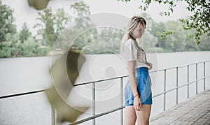 Pretty nice blonde woman in rainy day