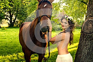 Pretty nude woman with horse