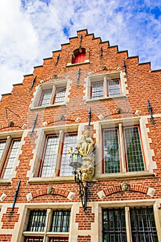 Pretty old house Bruges city view at summer day Belgium