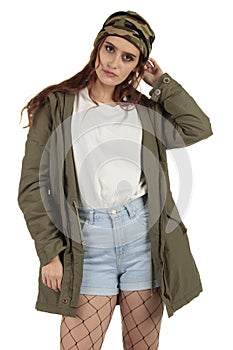 Pretty parka coat wearing grunge, rock punk girl in a long oversized white t-shirt with a blank space ready for your design