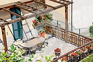 A pretty patio with chairs and table, Italy