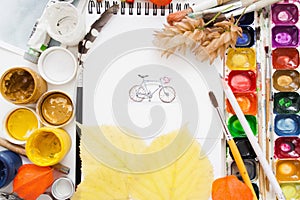 Pretty pictured bicycle on artist work flat lay