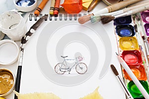 Pretty pictured bicycle with drawing supplies