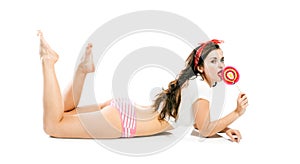 Pretty pin up girl in panties and big lollipop