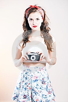 Pretty pin up girl and vintage camera