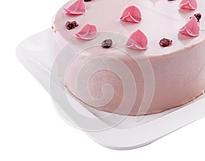 Pretty pink cake decorated with icing sugar roses