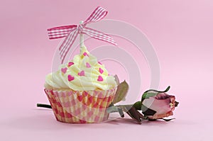 Pretty pink cupcake with pale pink silk rose bud