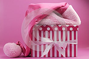 Pretty pink feminine santa hat and polka dot and stripe gift box