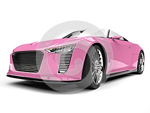 Pretty pink modern cabriolet sports car - low angle front view