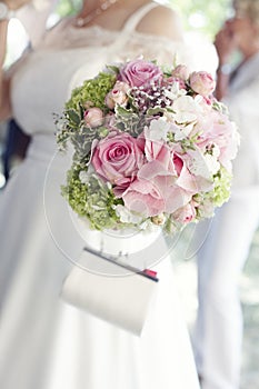 Pretty pink roses in bridal bouquet