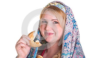 Pretty Plus size Woman in russian national scarf with a pile of