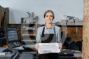 pretty and positive typographer in apron