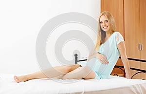 Pretty pregnancy woman wakes up