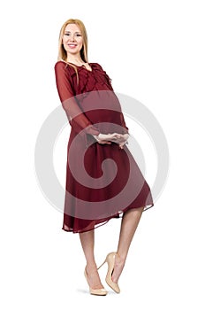 Pretty pregnant woman in red dress isolated on