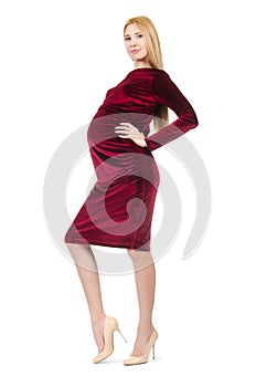 Pretty pregnant woman in red dress isolated on the