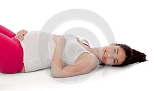Pretty pregnant woman resting in her training