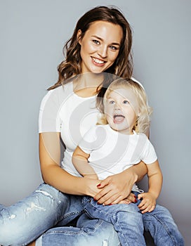 Pretty real fashion mother with cute blond little daughter close up smiling happy, lifestyle people concept