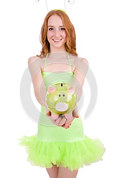 Pretty red hair fairy in green dress holding