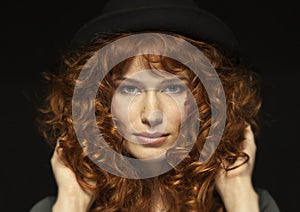 Pretty red-haired girl with curls, freckles