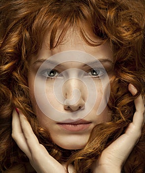 Pretty red-haired girl with curls, freckles, Portrait