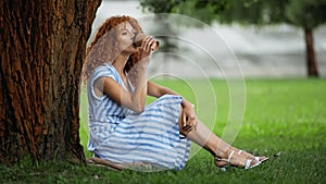 pretty redhead woman in blue dress