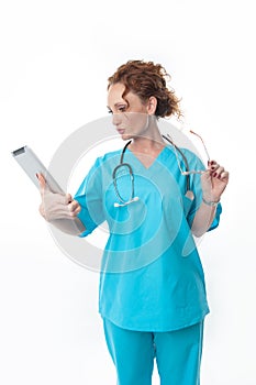 Pretty Redhead Woman Nurse Looking at Tablet