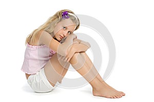Pretty sad teenage girl sit on floor