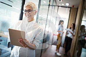 Pretty senior business woman, successful confidence in financial building