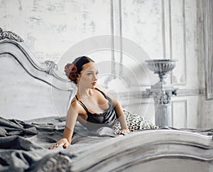 Pretty slim brunette woman resting in luxury room