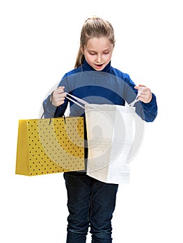 Pretty small girl with shopping bags