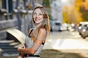 Pretty smile woman sunlight city portrait