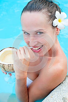 Pretty smiley woman drinking cocktail