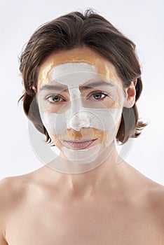 Pretty smiling brunette woman with face mask