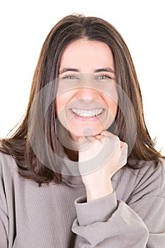 Pretty smiling cute young woman hand on chin portrait pretty girl looking in white background in beige sweater