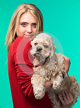 Pretty smiling girl with american spaniel