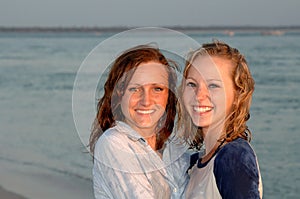 Pretty smiling teen faces at beach