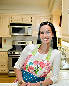Pretty Smiling Woman in Modern Kitchen