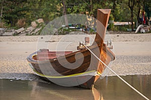 Pretty Southeast Asian traditional wooden long tail boat