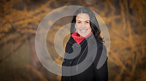 Pretty Spanish Woman Smiling At the camera. Outside and standing up in a forest