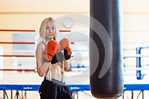 Pretty sport woman with boxing gloves