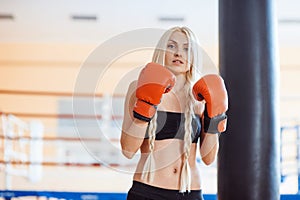 Pretty sport woman with boxing gloves